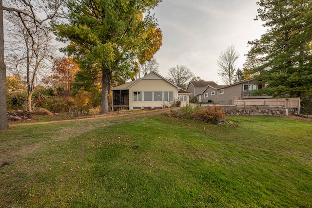 view of yard featuring a sunroom