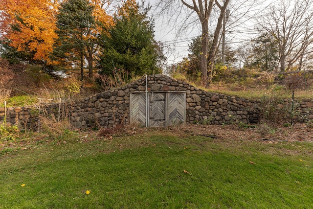 view of outdoor structure with a lawn