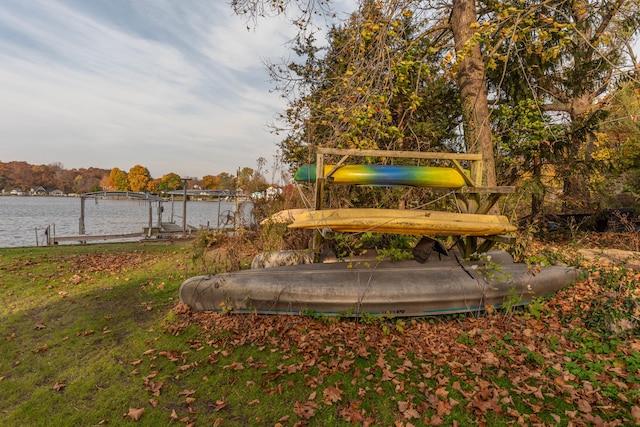 exterior space with a dock and a water view