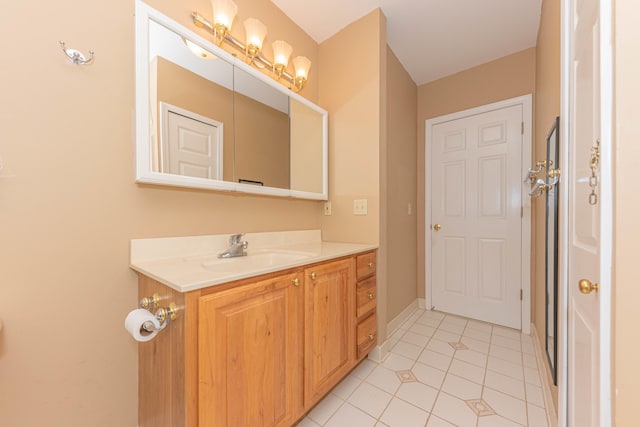 bathroom with vanity and tile patterned flooring