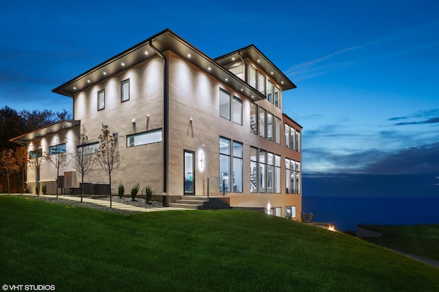 view of outdoor building at dusk