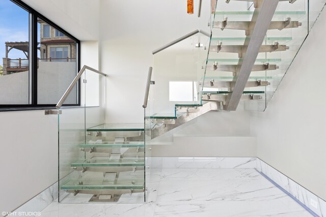 staircase with plenty of natural light