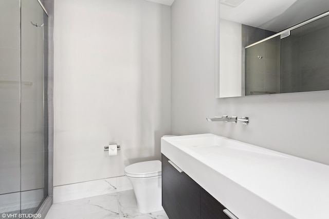 bathroom featuring an enclosed shower, vanity, and toilet