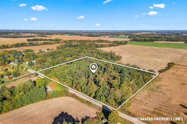 birds eye view of property with a rural view