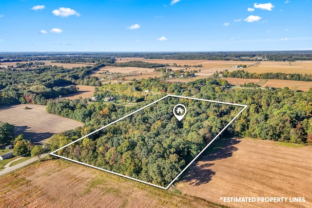 birds eye view of property featuring a rural view