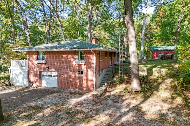 view of side of home featuring a garage