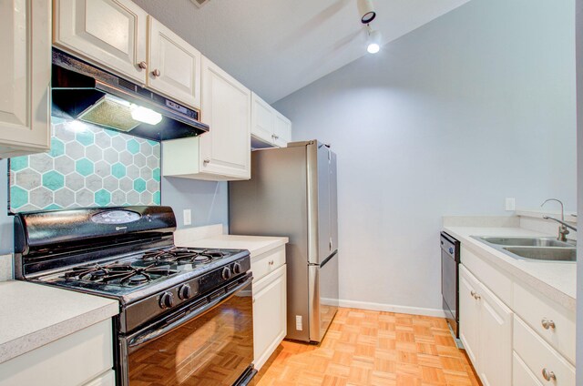 kitchen featuring black appliances, white cabinets, sink, and tasteful backsplash