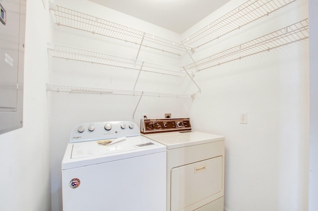 clothes washing area featuring washing machine and clothes dryer