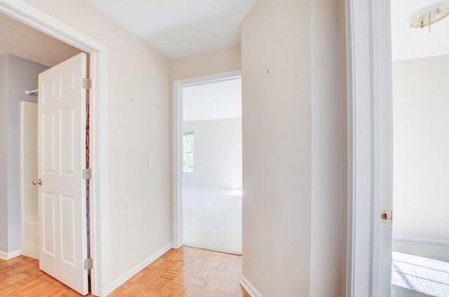 corridor featuring light parquet floors