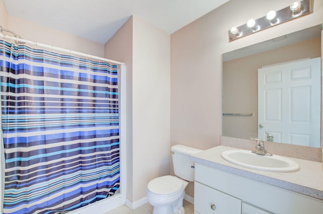 bathroom featuring toilet, walk in shower, and vanity