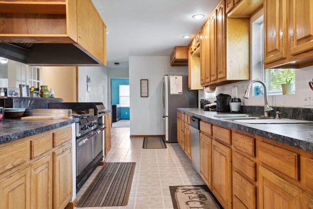 kitchen with ventilation hood, light tile patterned floors, stainless steel appliances, and sink