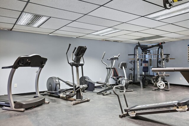 workout area featuring a drop ceiling