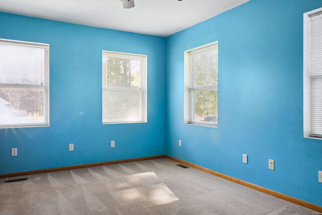 unfurnished room with light colored carpet