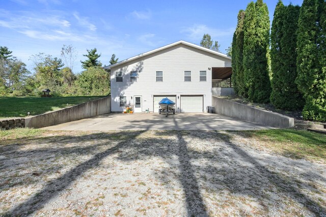 view of side of property with a garage