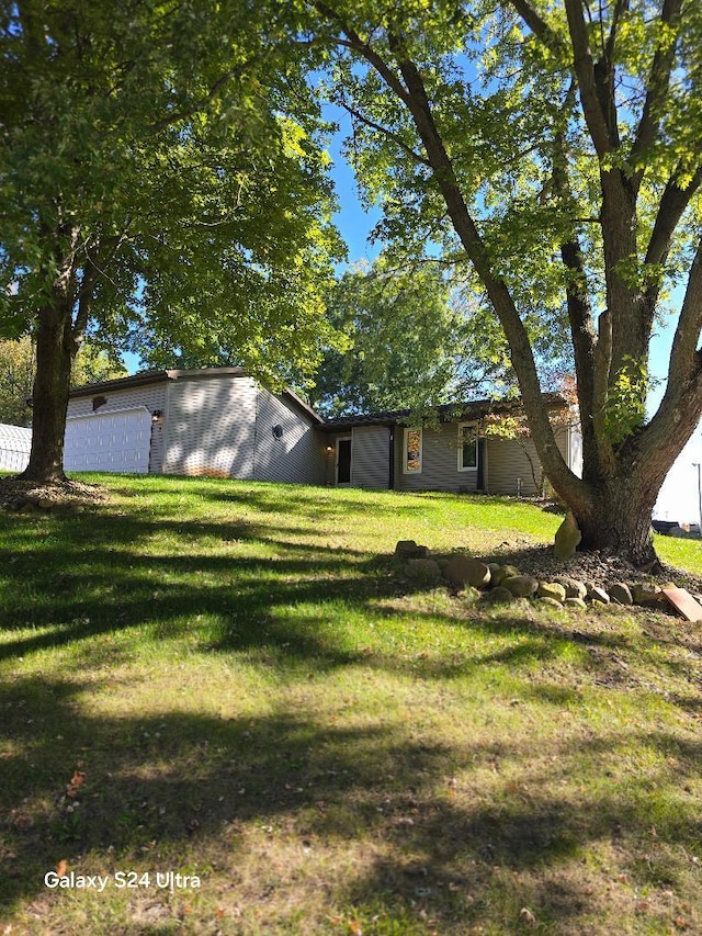 view of yard with a garage