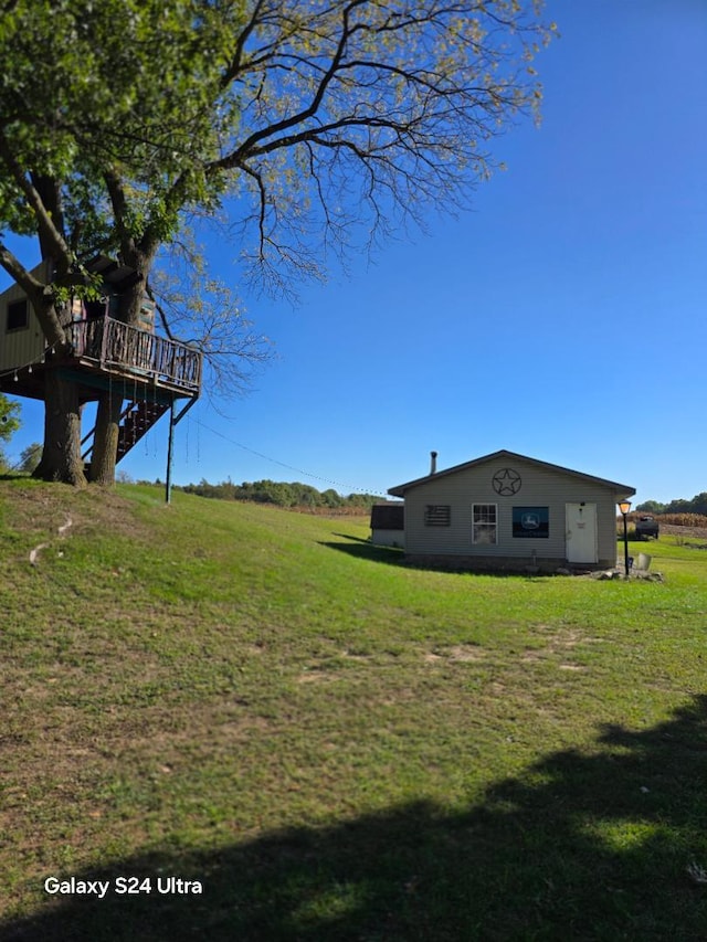 view of yard featuring a wooden deck