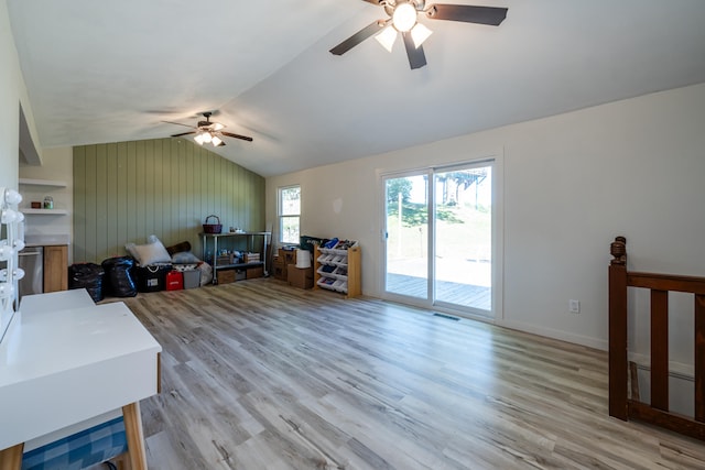 interior space with ceiling fan, light wood-type flooring, and lofted ceiling