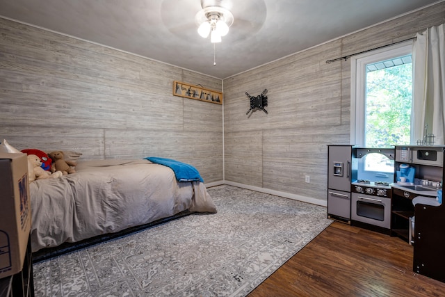 bedroom featuring dark hardwood / wood-style flooring and ceiling fan