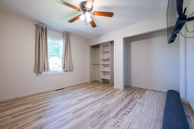 unfurnished bedroom with ceiling fan and light hardwood / wood-style flooring