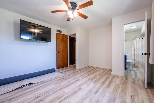 unfurnished bedroom with ceiling fan, light hardwood / wood-style floors, and ensuite bathroom