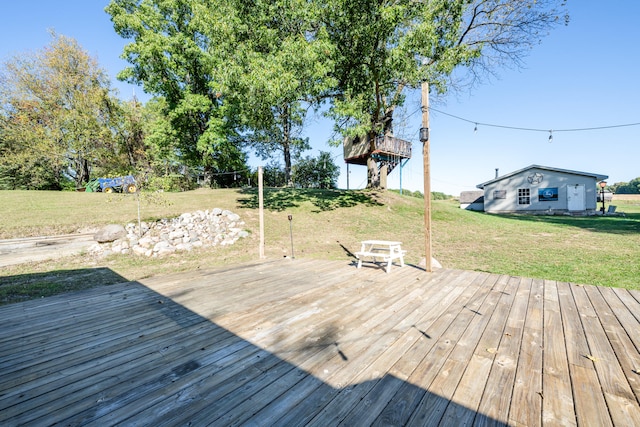 wooden terrace with a yard