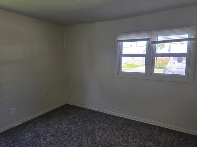 unfurnished room featuring carpet flooring