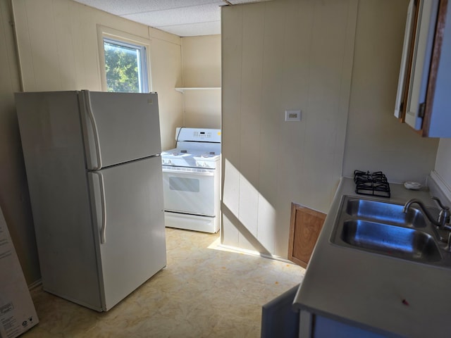 kitchen with white appliances and sink