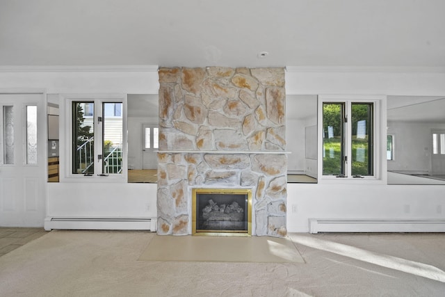 carpeted living room with ornamental molding, a wealth of natural light, and a baseboard heating unit