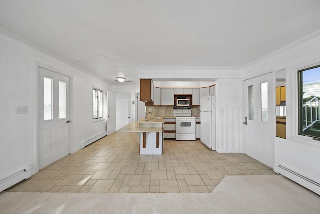 kitchen featuring a baseboard radiator, ornamental molding, white appliances, and decorative backsplash