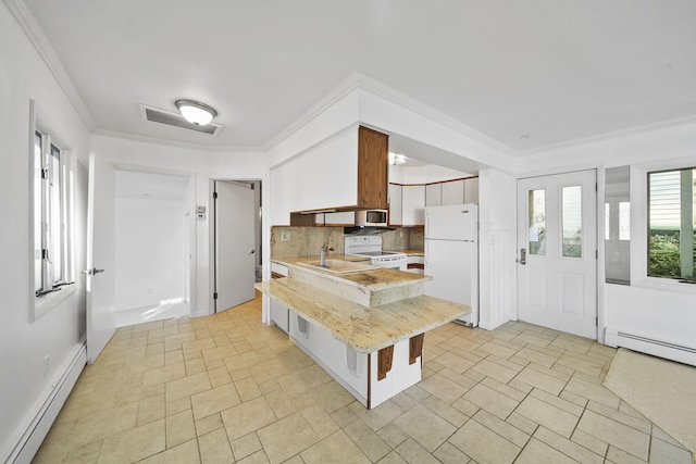 kitchen featuring kitchen peninsula, white appliances, a kitchen breakfast bar, and baseboard heating