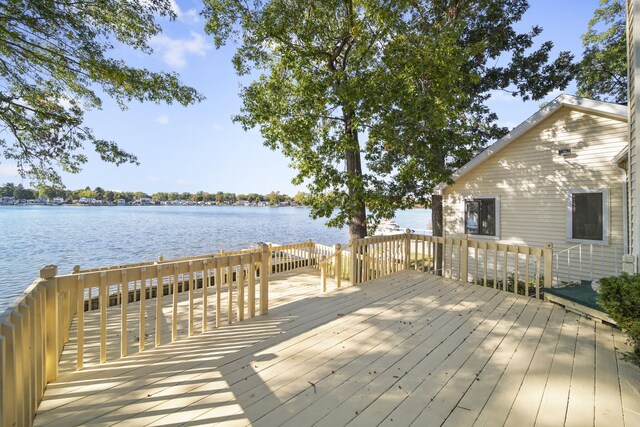 wooden terrace with a water view