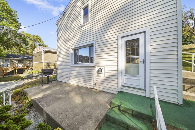 back of house featuring a deck