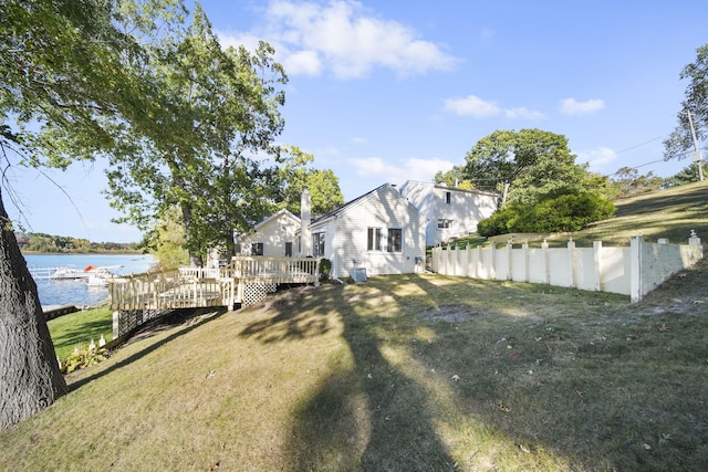 view of yard featuring a deck with water view