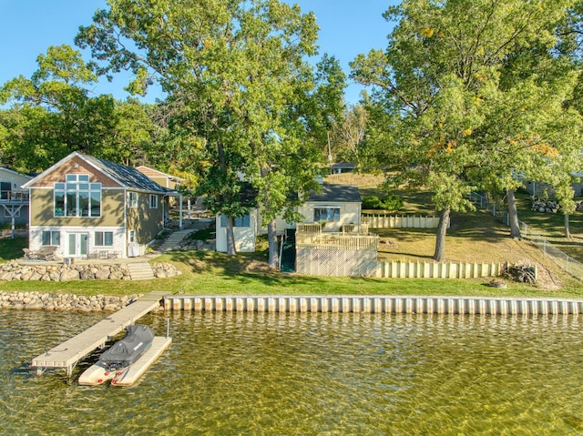 back of house with a water view