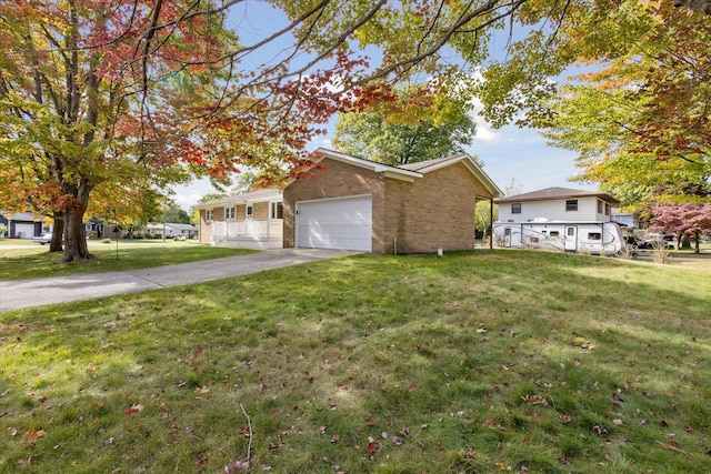 view of front of home with a garage and a front yard