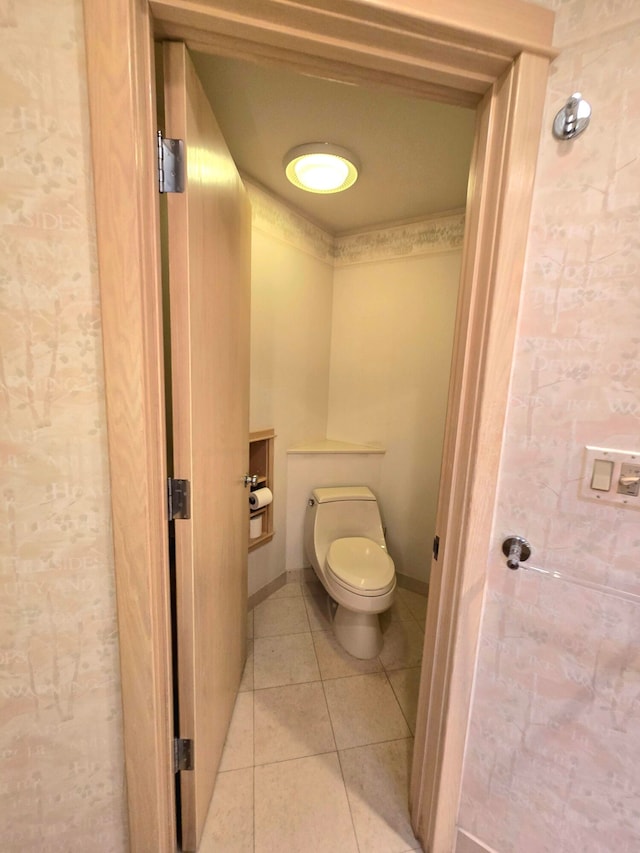 bathroom with tile patterned flooring and toilet