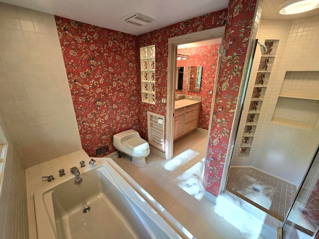 full bathroom with tile patterned floors, plus walk in shower, vanity, and toilet