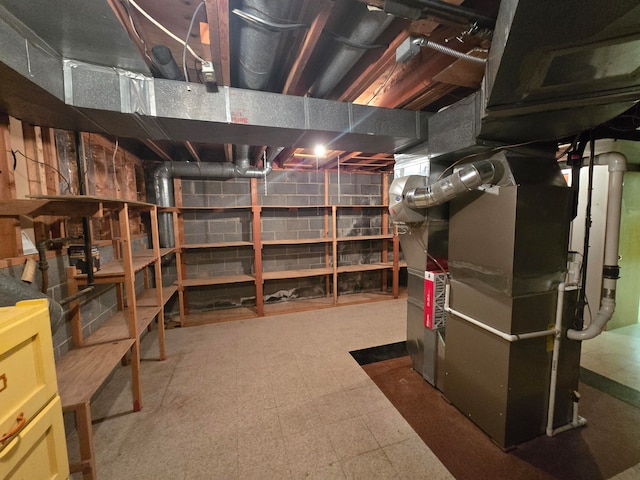 basement featuring heating unit