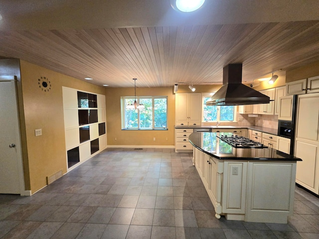 kitchen featuring pendant lighting, stainless steel gas stovetop, white cabinetry, island range hood, and wood ceiling