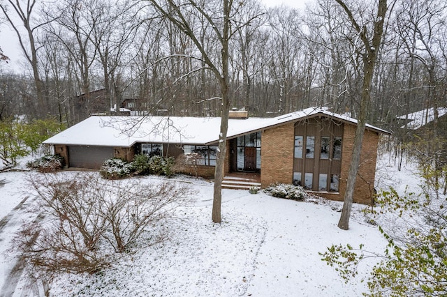 snow covered property featuring covered porch