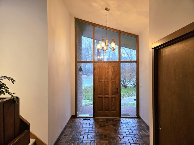 foyer entrance with an inviting chandelier