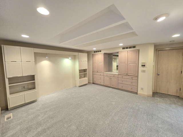 basement featuring light colored carpet