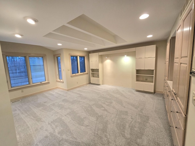 unfurnished living room with light colored carpet