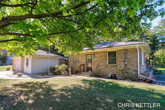 single story home with a garage and a front yard