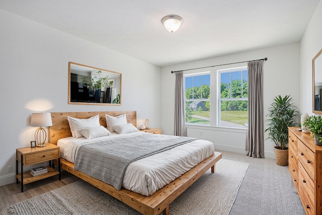 bedroom with hardwood / wood-style floors