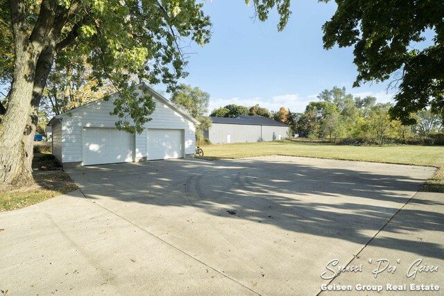 garage featuring a lawn