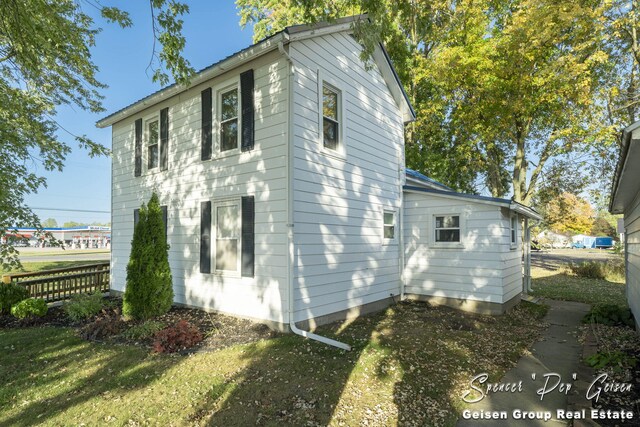 view of home's exterior featuring a lawn