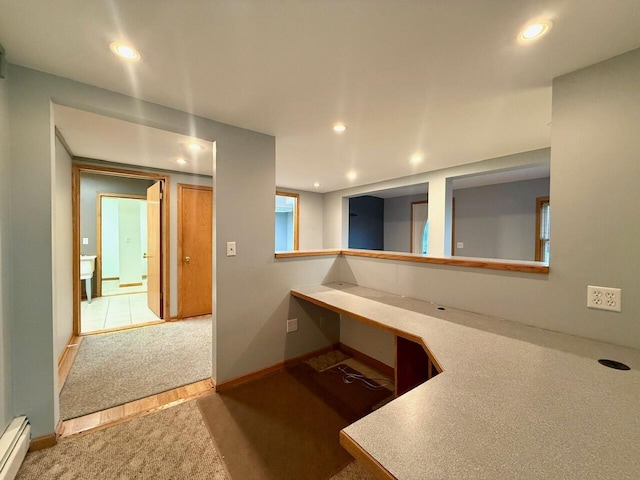 kitchen featuring carpet flooring and a baseboard radiator