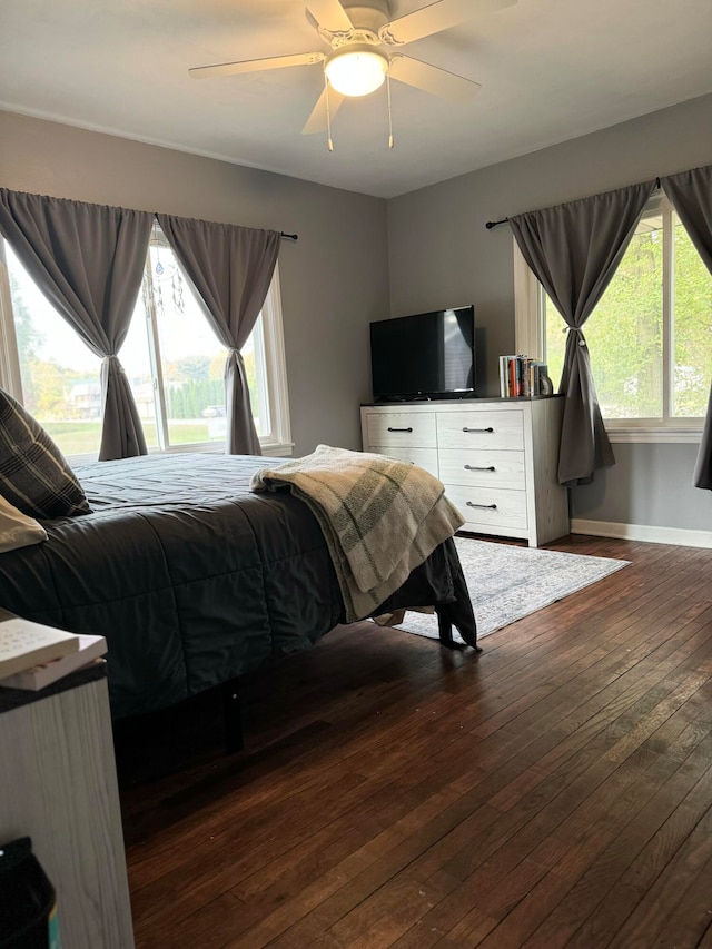 bedroom featuring ceiling fan and dark hardwood / wood-style floors