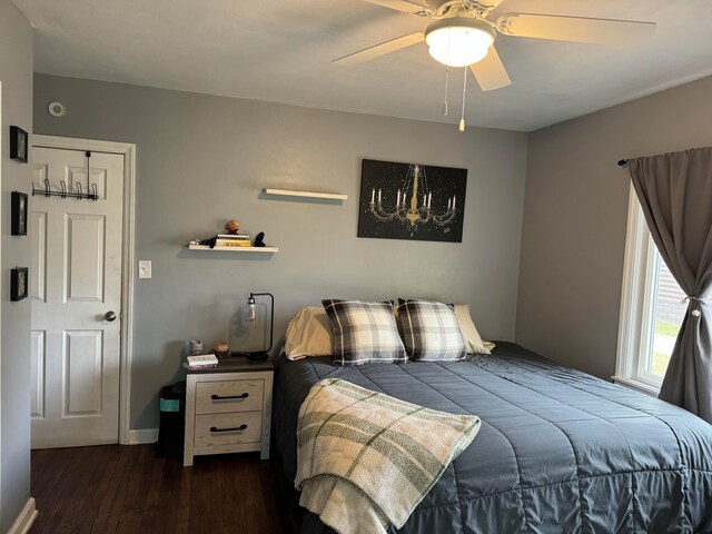 bedroom featuring ceiling fan and dark wood-type flooring